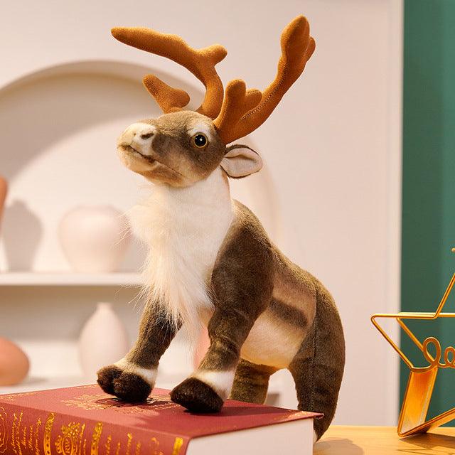 Festive plush reindeer set featuring two reindeer stacked playfully, displayed in a holiday-themed setting with decorations and gifts.