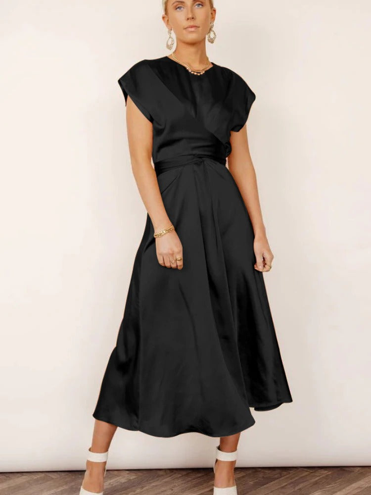 A graceful women's satin wrap dress with an elegant flow, featuring a flattering silhouette and luxurious fabric, perfect for formal occasions or special events.