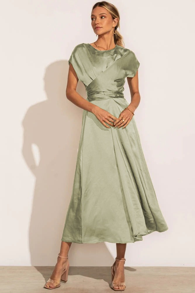 A graceful women's satin wrap dress with an elegant flow, featuring a flattering silhouette and luxurious fabric, perfect for formal occasions or special events.