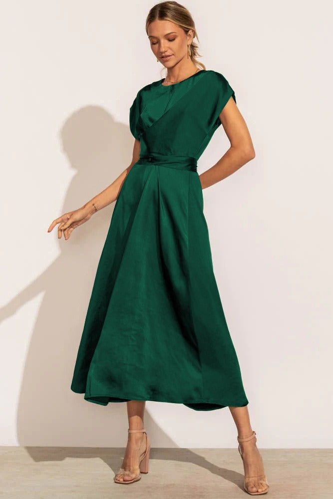 A graceful women's satin wrap dress with an elegant flow, featuring a flattering silhouette and luxurious fabric, perfect for formal occasions or special events.