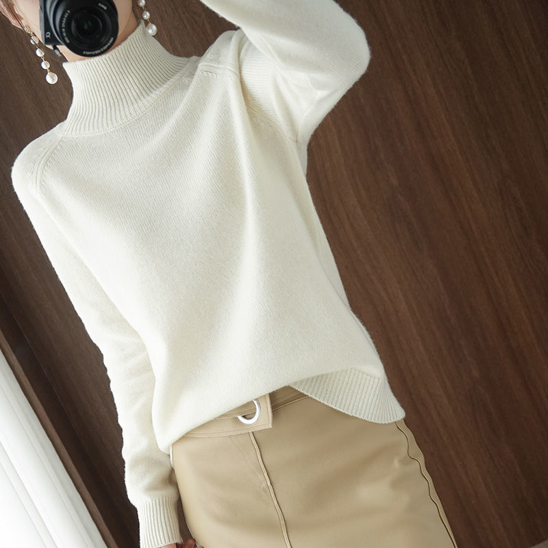 A women's turtleneck sweater featuring an elegant style and sleek design, perfect for casual wear or layering for a sophisticated look.