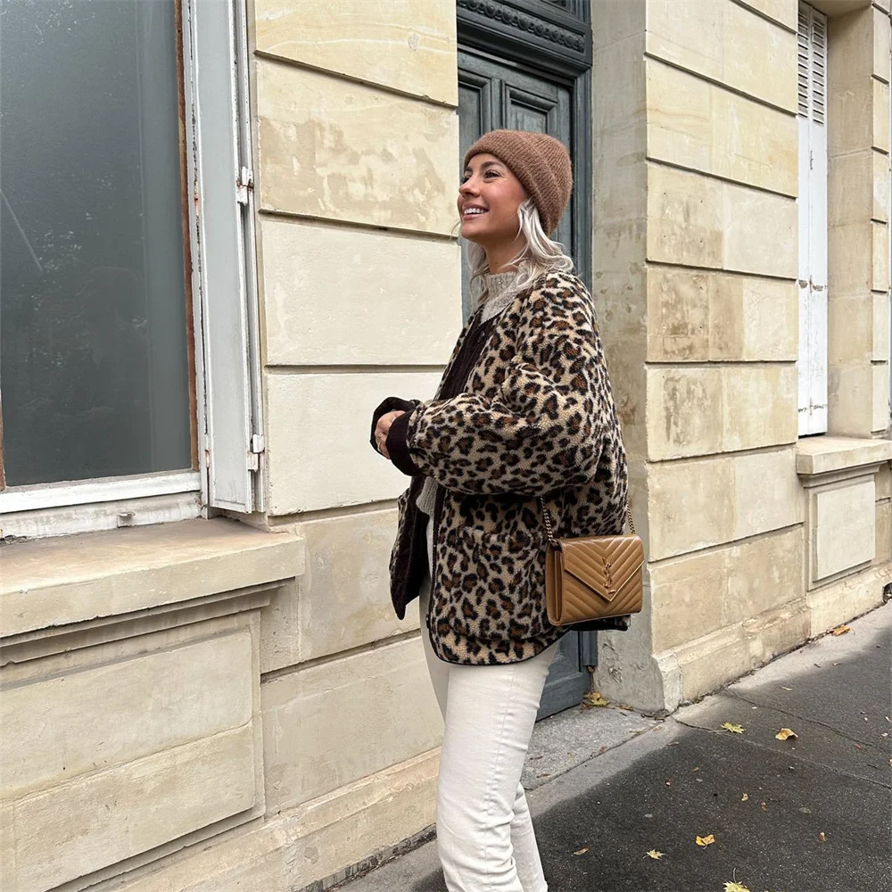 A women's patterned jacket with a bold statement design, styled with a chic outfit, perfect for adding a touch of confidence and unique flair to casual or semi-formal looks.
