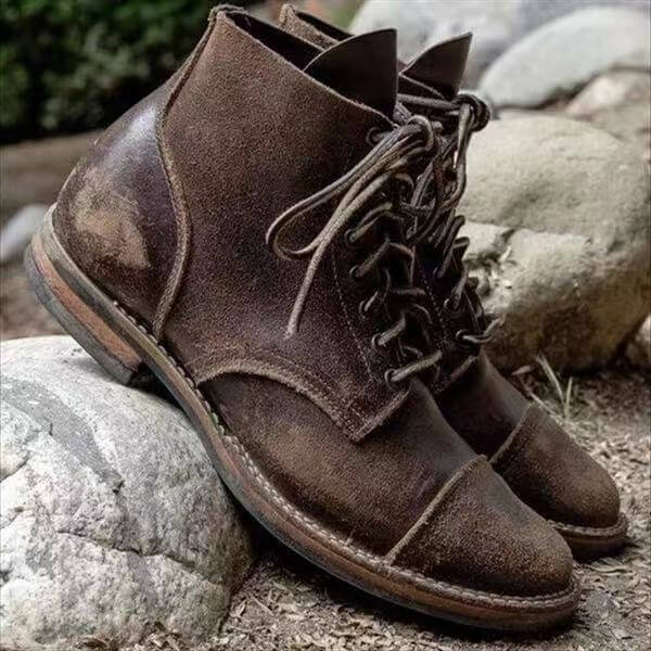 A pair of durable lace-up boots with a timeless design, showcasing sturdy construction and stylish details, perfect for casual or outdoor wear.