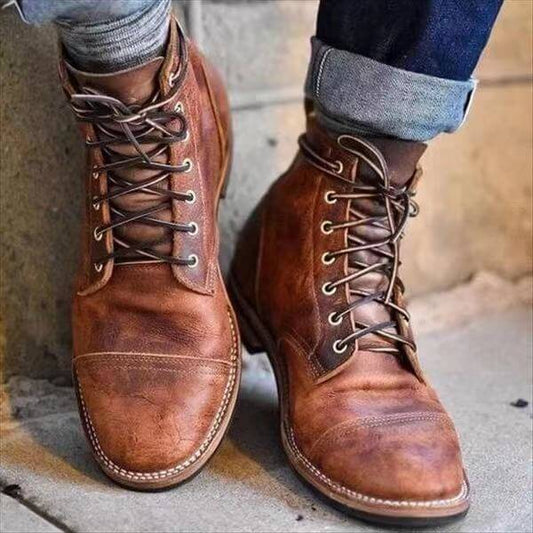 A pair of durable lace-up boots with a timeless design, showcasing sturdy construction and stylish details, perfect for casual or outdoor wear.