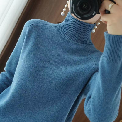 A women's turtleneck sweater featuring an elegant style and sleek design, perfect for casual wear or layering for a sophisticated look.