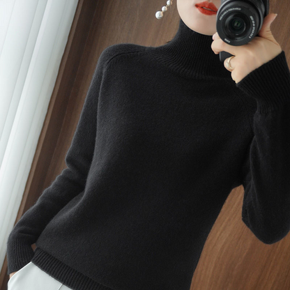 A women's turtleneck sweater featuring an elegant style and sleek design, perfect for casual wear or layering for a sophisticated look.