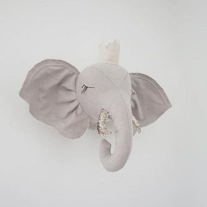 A decorative elephant wall hanging with an elegant design, featuring detailed craftsmanship and a whimsical touch, perfect for nurseries, kids' rooms, or as unique home decor.