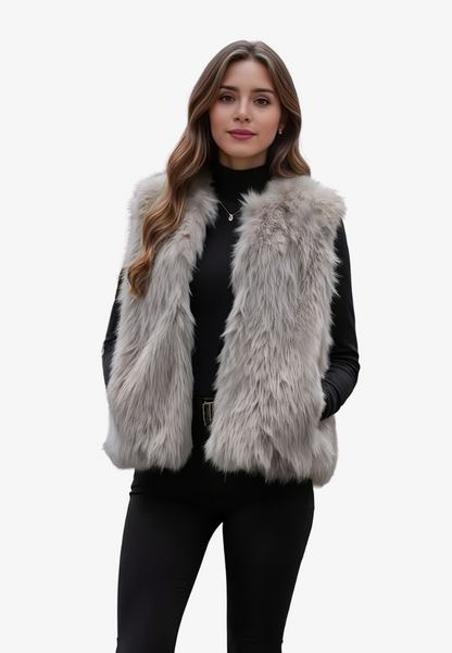 A stylish woman wearing a fluffy vest paired with a turtleneck top and a skirt, showcasing the elegant design and cozy texture of the Ava Women's Fluffy Vest, ideal for layering in chic outfits.