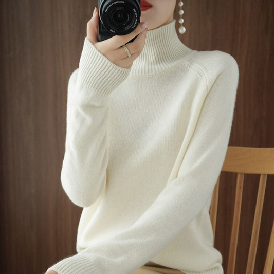A women's turtleneck sweater featuring an elegant style and sleek design, perfect for casual wear or layering for a sophisticated look.