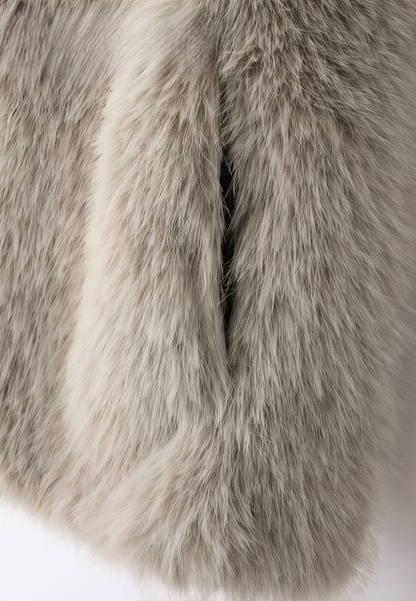 A stylish woman wearing a fluffy vest paired with a turtleneck top and a skirt, showcasing the elegant design and cozy texture of the Ava Women's Fluffy Vest, ideal for layering in chic outfits.