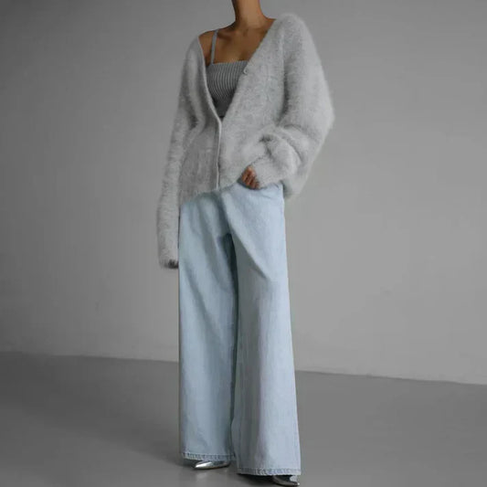 Women's soft knit cardigan with button-down front, featuring a cozy and elegant design, perfect for layering or standalone wear.