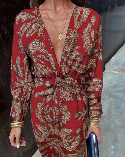 A woman wearing a floral maxi dress with an elegant fit, styled with statement accessories and heels, perfect for formal events or casual outings.