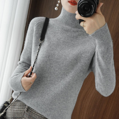 A women's turtleneck sweater featuring an elegant style and sleek design, perfect for casual wear or layering for a sophisticated look.