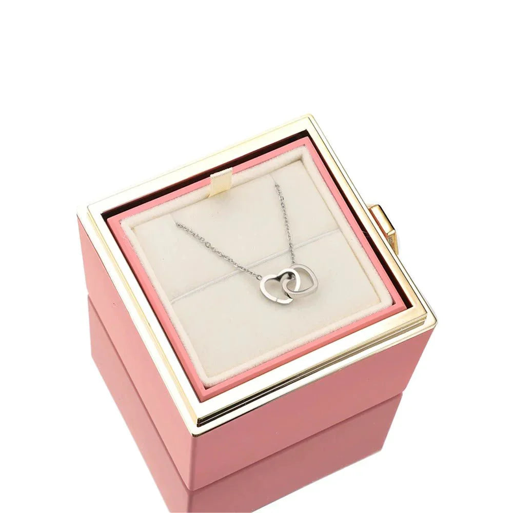 Elegant interlocking necklace displayed in a luxurious jewelry box, highlighting its timeless and sophisticated design.
