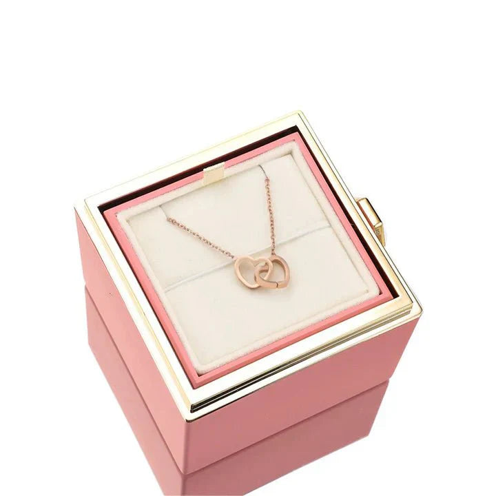 Elegant interlocking necklace displayed in a luxurious jewelry box, highlighting its timeless and sophisticated design.