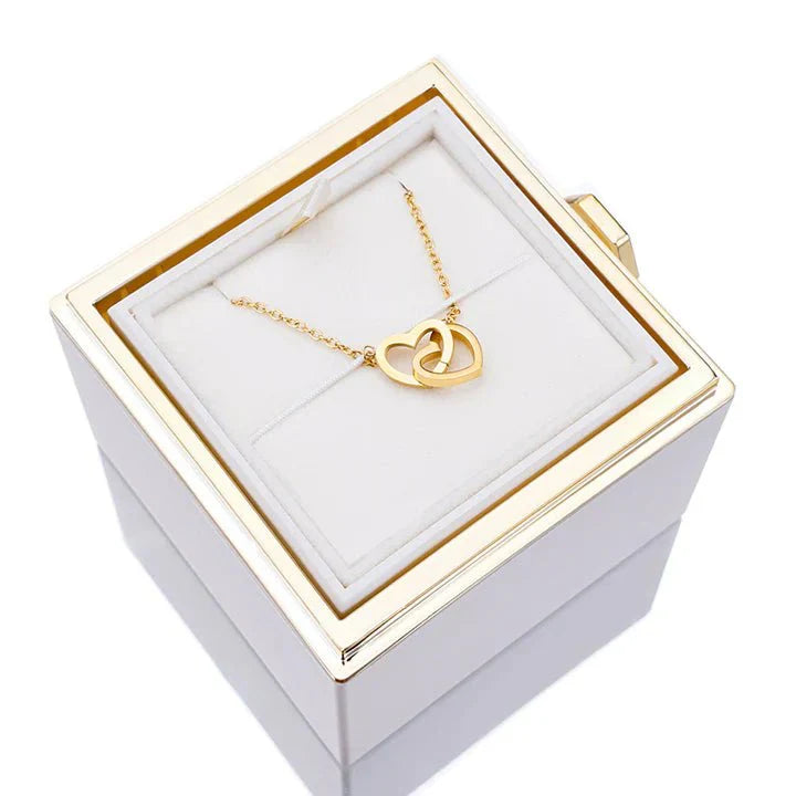 Elegant interlocking necklace displayed in a luxurious jewelry box, highlighting its timeless and sophisticated design.