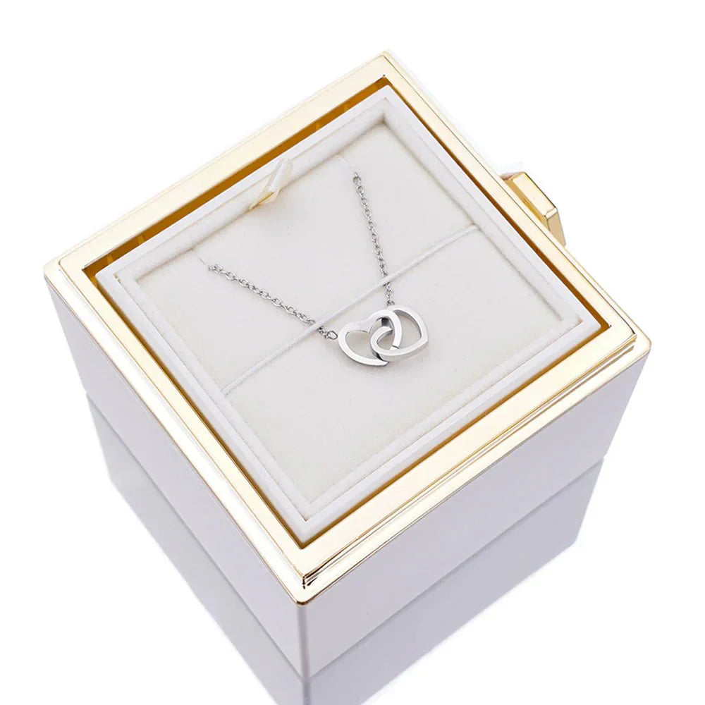 Elegant interlocking necklace displayed in a luxurious jewelry box, highlighting its timeless and sophisticated design.