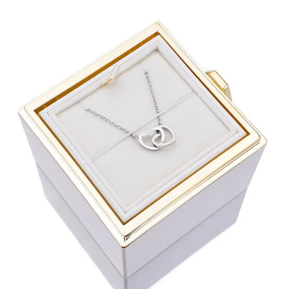 Elegant interlocking necklace displayed in a luxurious jewelry box, highlighting its timeless and sophisticated design.