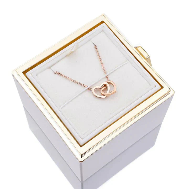 Elegant interlocking necklace displayed in a luxurious jewelry box, highlighting its timeless and sophisticated design.