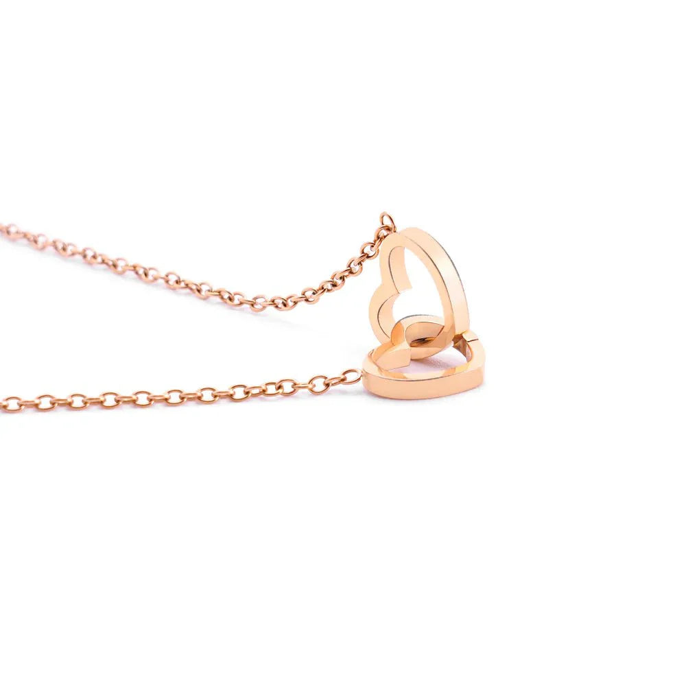 Elegant interlocking necklace displayed in a luxurious jewelry box, highlighting its timeless and sophisticated design.