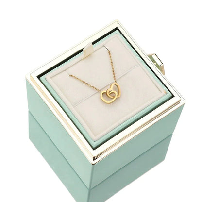 Elegant interlocking necklace displayed in a luxurious jewelry box, highlighting its timeless and sophisticated design.