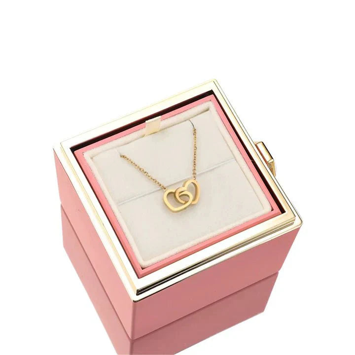 Elegant interlocking necklace displayed in a luxurious jewelry box, highlighting its timeless and sophisticated design.