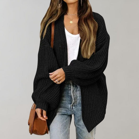 Women's cozy knit cardigan with a relaxed fit, featuring a stylish open-front design perfect for layering over casual or dressy outfits.
