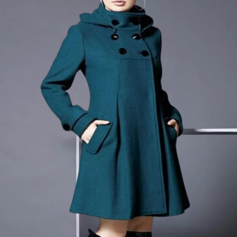 Elegant women's coat with a tailored fit and sophisticated design, featuring a high collar and button details for a timeless and refined look.