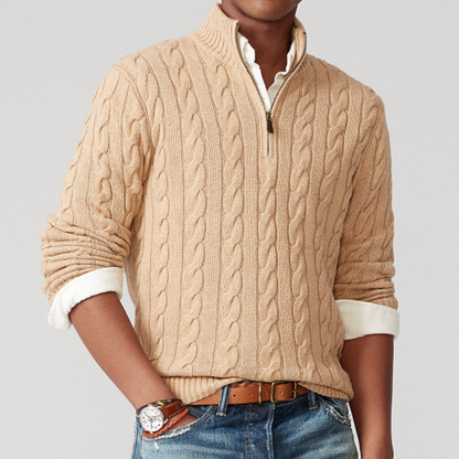A men's cable knit sweater featuring a classic design with a zip-up collar, tailored for warmth and style, perfect for casual wear or layering in colder weather.
