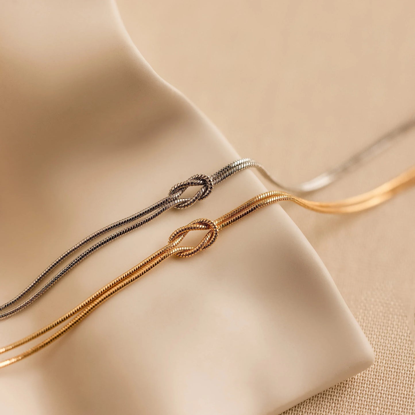 Minimalist bracelet with a sleek design displayed on a wrist, showcasing its elegant and timeless style in a cozy setting.