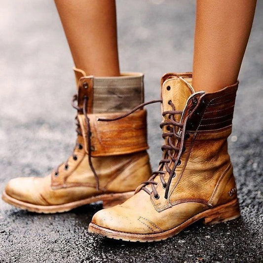 A pair of stylish combat boots with a durable design, featuring lace-up details and a rugged sole, perfect for casual wear or outdoor adventures.