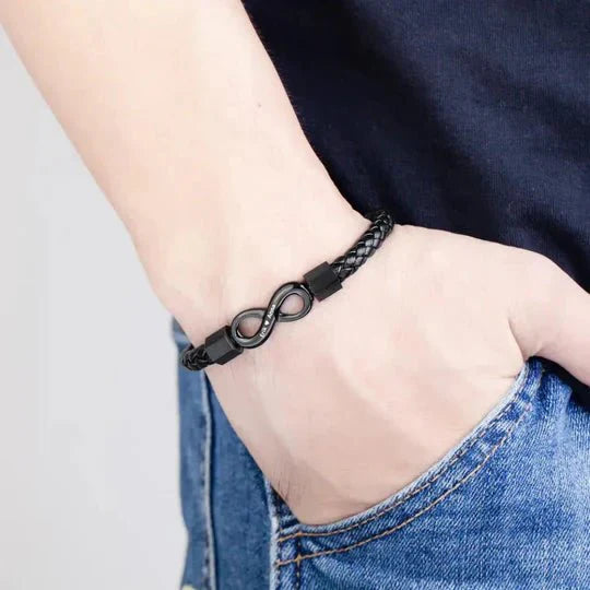 Stylish braided infinity bracelet showcased on a man's wrist, highlighting its elegant and timeless design.