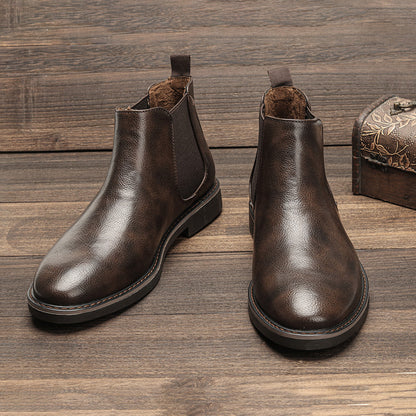 Men's ankle boots with a sleek design and durable construction, featuring a pull-tab and sturdy sole, perfect for versatile everyday wear.