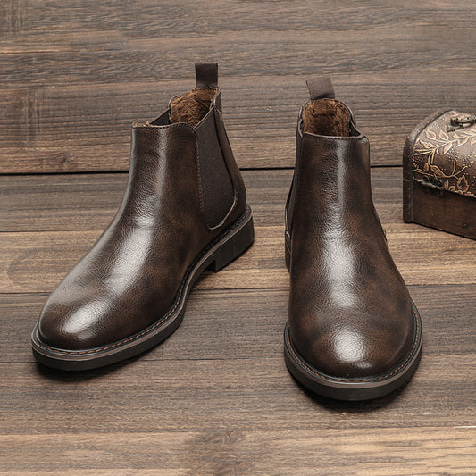 Men's ankle boots with a sleek design and durable construction, featuring a pull-tab and sturdy sole, perfect for versatile everyday wear.