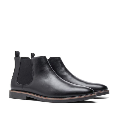 Men's ankle boots with a sleek design and durable construction, featuring a pull-tab and sturdy sole, perfect for versatile everyday wear.