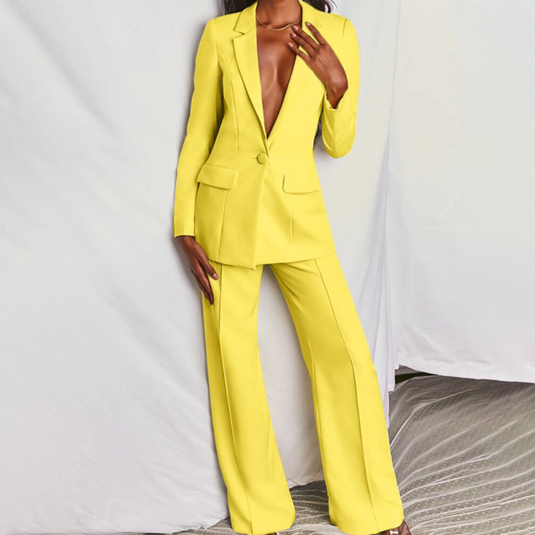 Elegant women's tailored suit set featuring a blazer and matching trousers, designed for a formal and sophisticated look.