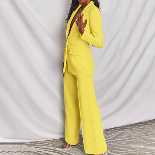 Elegant women's tailored suit set featuring a blazer and matching trousers, designed for a formal and sophisticated look.
