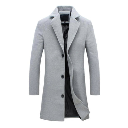 Long tailored overcoat with button closure, designed for a sleek and timeless look, displayed on a neutral background.
