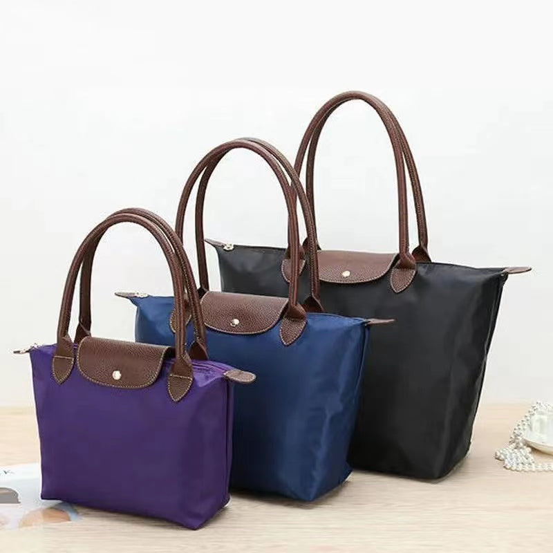 A collection of women's stylish tote bags with a versatile design, featuring sturdy handles, a spacious interior, and a sleek, practical look, perfect for work, shopping, or everyday use.