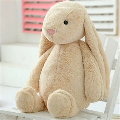 A plush bunny toy with a soft, huggable design and floppy ears, perfect for snuggles, playtime, or as a charming decorative piece for all ages.