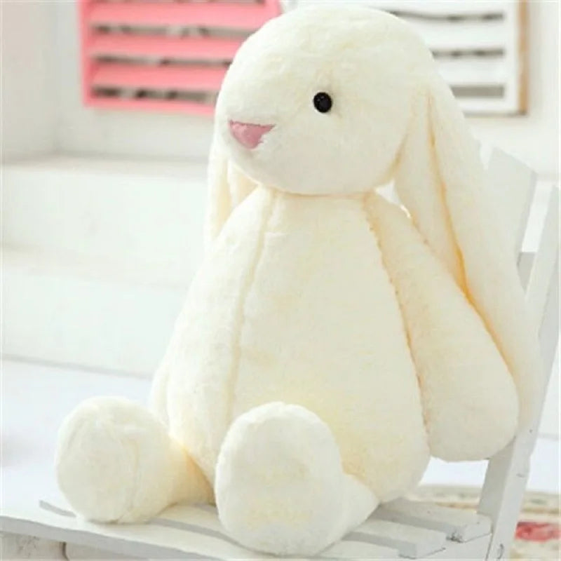 A plush bunny toy with a soft, huggable design and floppy ears, perfect for snuggles, playtime, or as a charming decorative piece for all ages.