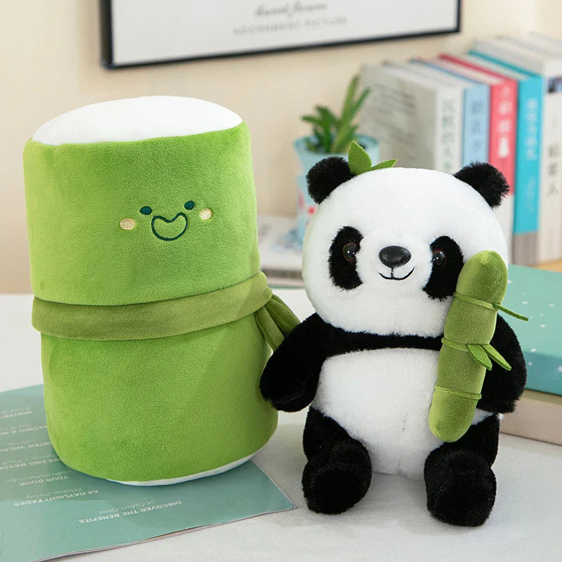 Plush panda toy set featuring a cute panda holding a bamboo and an adorable smiling roll-shaped plush companion, displayed on a table with books in the background.