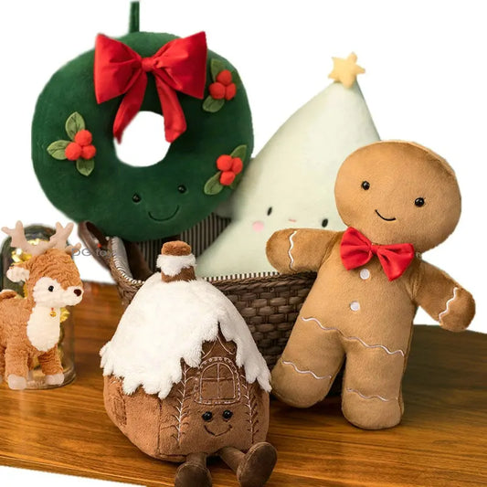 Festive plush toy set featuring a Christmas tree, gingerbread house, wreath, and gingerbread figure, displayed in a cozy holiday-themed setting with wrapped gifts and decorations.
