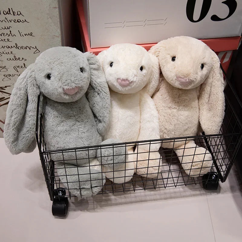 A plush bunny toy with a soft, huggable design, featuring long floppy ears and a charming appearance, perfect for cuddling, playtime, or gifting to loved ones.