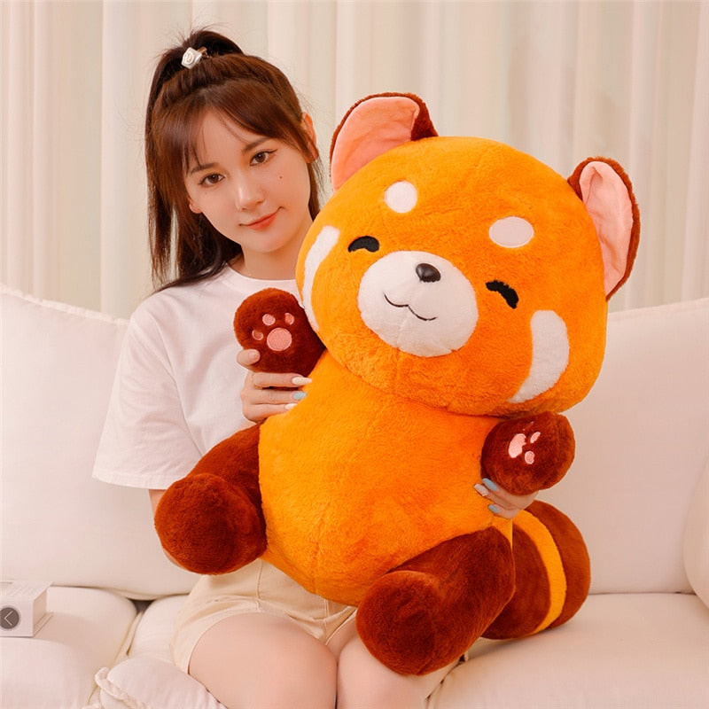 A plush toy featuring an adorable animal design, shown in two sizes, with a soft, huggable texture. Perfect as a cuddly companion for kids or a thoughtful gift for any occasion.