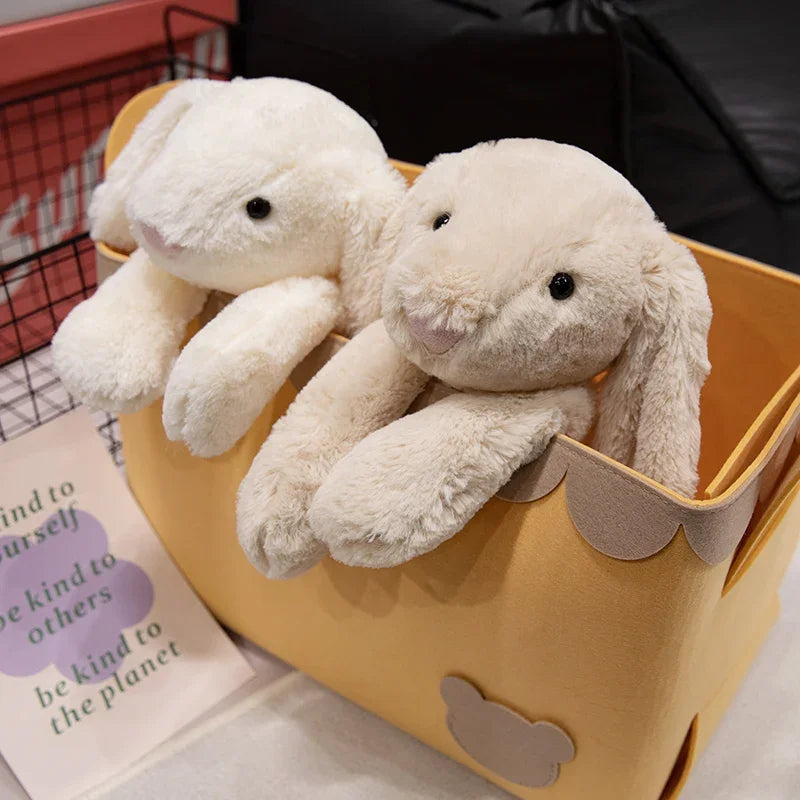 A plush bunny toy with a soft, huggable design, featuring long floppy ears and a charming appearance, perfect for cuddling, playtime, or gifting to loved ones.