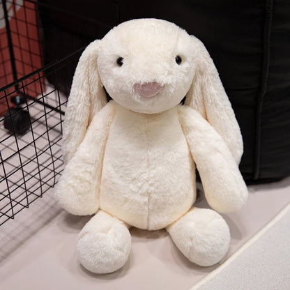 A plush bunny toy with a soft, huggable design, featuring long floppy ears and a charming appearance, perfect for cuddling, playtime, or gifting to loved ones.