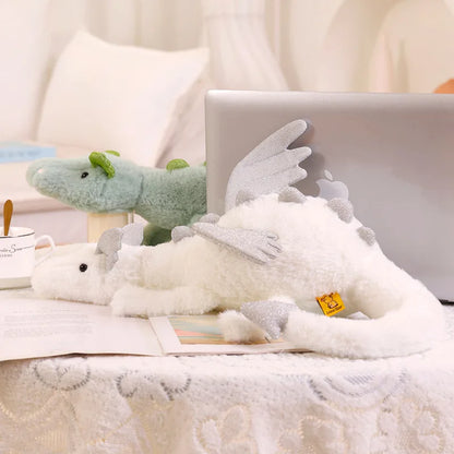 A plush dragon toy featuring a whimsical design with detailed wings and a soft, huggable texture, perfect for playtime, snuggles, or as a unique gift for all ages.