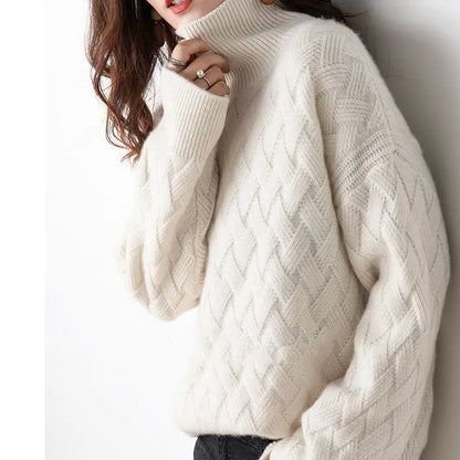 Close-up of a cozy textured knit sweater with a turtleneck design, highlighting the intricate pattern and soft material, perfect for a stylish and warm look.