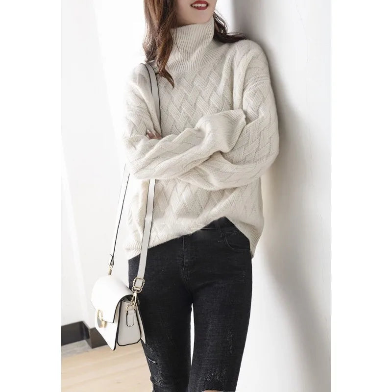 Close-up of a cozy textured knit sweater with a turtleneck design, highlighting the intricate pattern and soft material, perfect for a stylish and warm look.